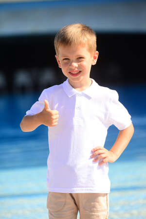 Portrait of young smiling boy in outdoors. Image with shallow DOF.の写真素材