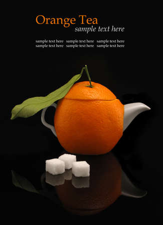 Orange teapot   sugar on black background                  の写真素材