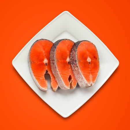steak Salmon on plate   red background