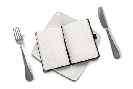 gnawing science  notebook on a plate isolate on a white backgroundの写真素材