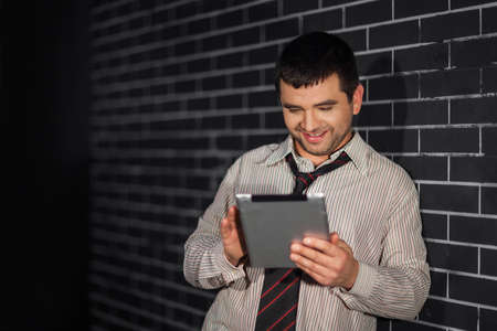 Smiling businessman with laptop の写真素材