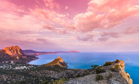 Beautiful sunset above the sea and mountainの写真素材