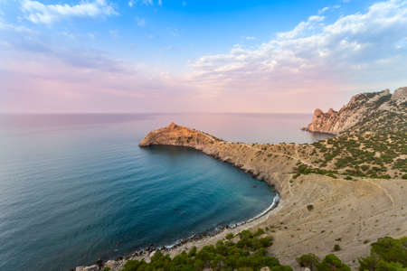 Beautiful sunset above the sea and mountainの写真素材