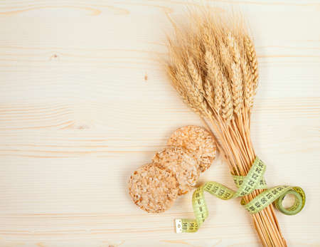 Rice cakes and wheat on table - healthy eating conceptの写真素材