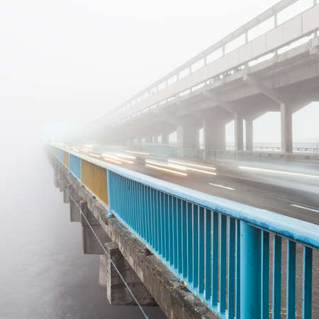 Metro bridge in Kiev in the fog at dawnの写真素材