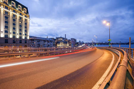 Car light trails and urban landscape. Moving car with blur light through city at night. Kiev city, Ukraine.の写真素材
