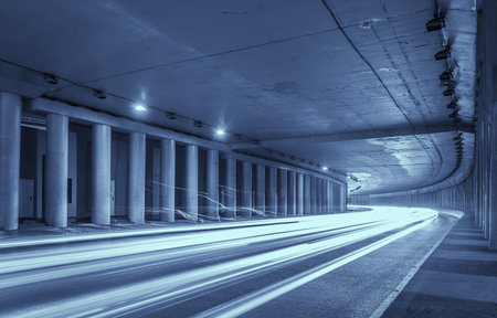 Car light trails in highway tunnelの写真素材