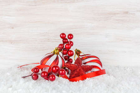 Christmas balls and snowflake on wooden backgroundの写真素材