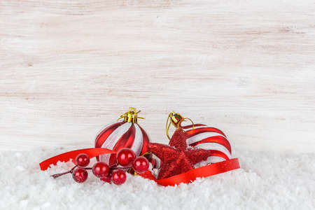 Christmas balls and snowflake on wooden backgroundの写真素材
