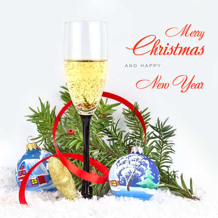 Christmas tree toys, champagne and snowflake on white backgroundの写真素材
