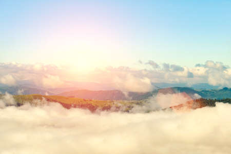 Majestic view on beautiful fog mountains in mist landscape. Dramatic unusual scene. Travel background. Exploring beauty world. Carpathian mountains. Ukraine. Europe.の写真素材