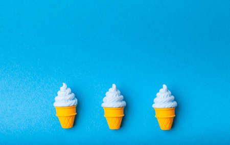 miniature Ice cream on a colorful background. Copy space. Summer time concept.の写真素材