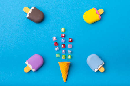 miniature Ice cream on a colorful background. Copy space. Summer time concept.の写真素材