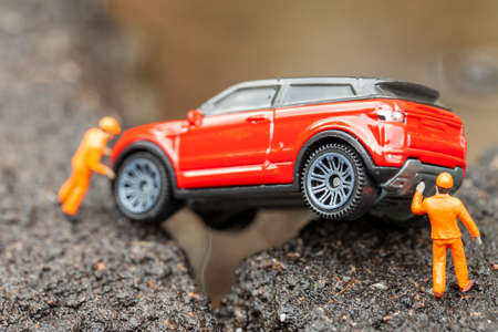 Miniature mechanics pulled out of the pit. Macro photo with shallow depth of field.の写真素材