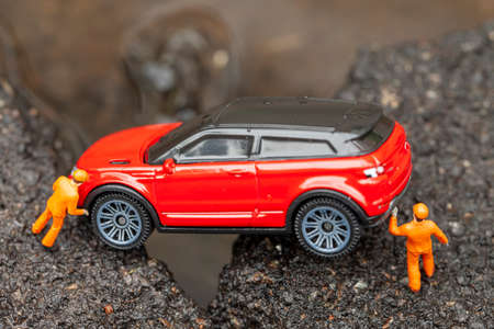 Miniature mechanics pulled out of the pit. Macro photo with shallow depth of field.の写真素材