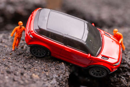 Miniature mechanics pulled out of the pit. Macro photo with shallow depth of field.の写真素材
