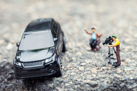 A film crew shooting a blockbuster scene. Macro photo with shallow depth of field.の写真素材
