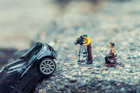 A film crew shooting a blockbuster scene. Macro photo with shallow depth of field.の写真素材