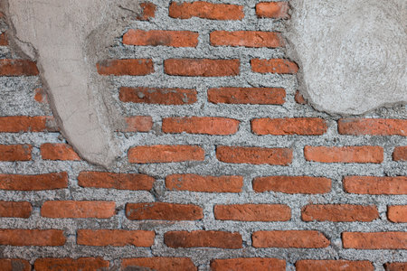 The old red brick masonry and plaster.の写真素材