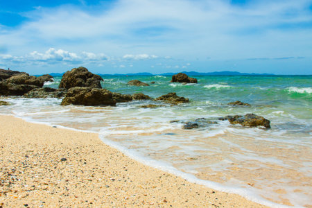 Waves rocks and beachの写真素材