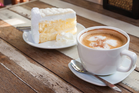 Cake and coffee kettle on the wood.の写真素材
