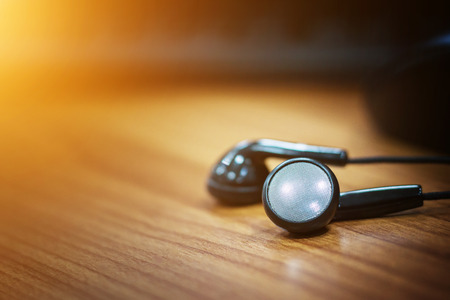 Headphones, mouse, keyboard, desk office.の写真素材