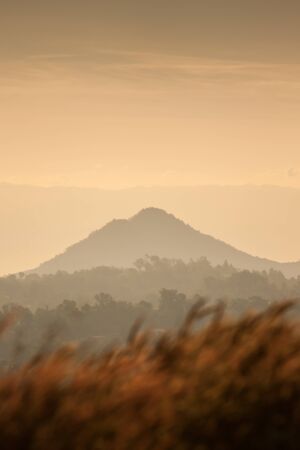 Meadows, trees, mountains and sunshine in Khao Kho, Thailandの写真素材