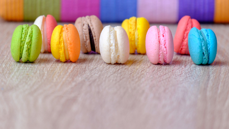 Macaron dessert and coffee on the wooden table.の写真素材