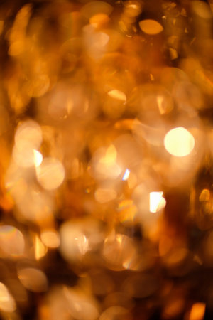 Blurred golden background and glittering light.