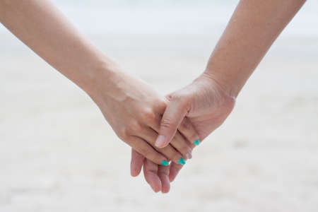 Hand holding handの写真素材
