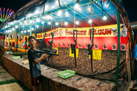 Phitsanulok / Thailand - 08152018: Thai people playing Shooting Game In the night market