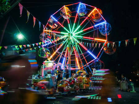 Phitsanulok/Thailand-11192018: People are bringing their children to play at an amusement park in the night market.のeditorial素材