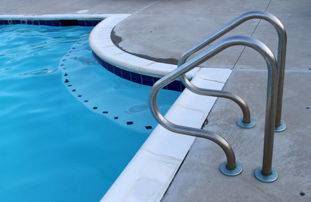 Swimming pool handrail