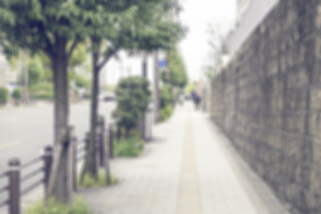 Blur image of Sidewalk in japan with bokeh for background usage. (vintage tone)の写真素材