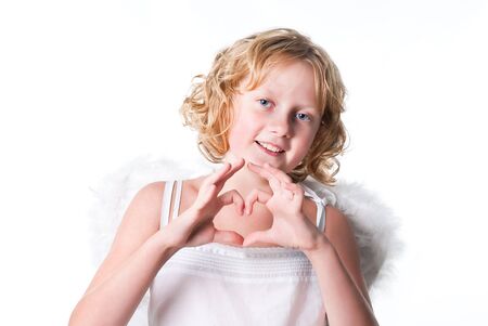 curly angel girl making a heartの写真素材