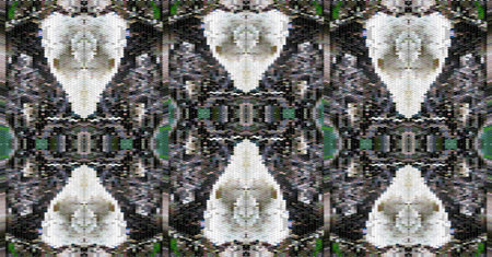 Black and green pattern with skulls reminiscent of Aztec design