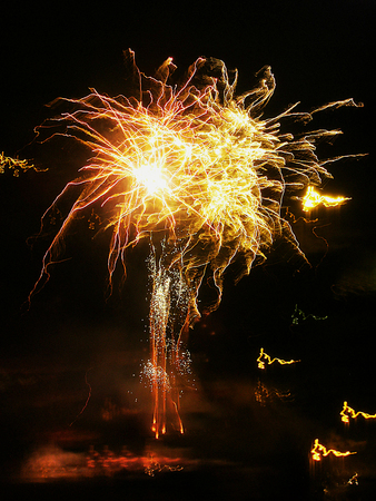 Fireworks with orange and red raysの写真素材