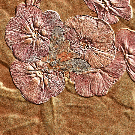 Background of embossed flowers with a butterfly on a wooden textureの写真素材