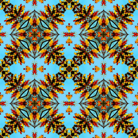 Seamless autumn pattern of stylized red, gold and brown leaves on a blue background