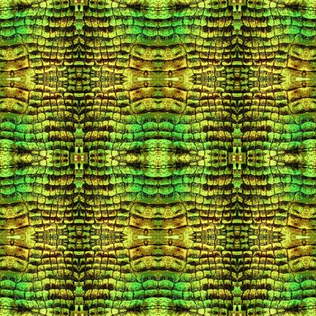 Abstract seamless pattern with snake leather. Green, brown and yellow background with scales resembling reptile skinの写真素材