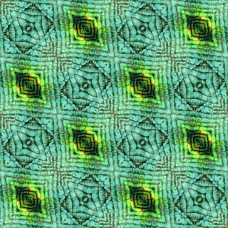 Abstract seamless wrinkled pattern of scales resembling snake skin. Green, black, orange and yellow background with reptile textureの写真素材