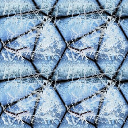 Winter seamless relief pattern of stones covered with ice crystals and frozen twigs. Blue and white 3d mosaic pattern of frozen stones and icingの写真素材
