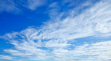 Fabulous transparent blue sky with light cumulus bright white beautiful clouds on a summer, spring, winter day. Fresh and pure wallpaper. Abstract background for landscape design.の写真素材