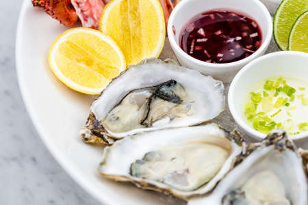 Fresh seafood platter with lobster, mussels and oystersの写真素材
