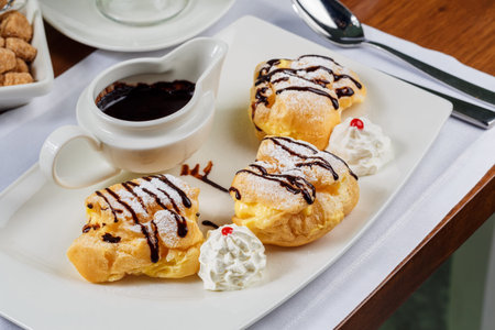 Eclairs with dark chocolateの写真素材