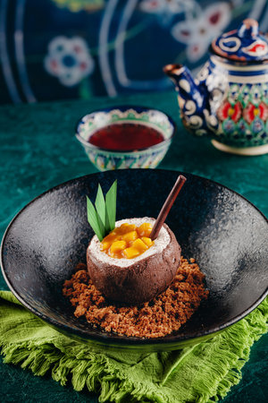 Good looking dessert coconut with cocoa and mangoの写真素材