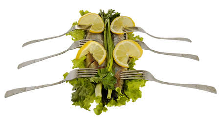 herring with greens and  lemon on  white backgroundの写真素材