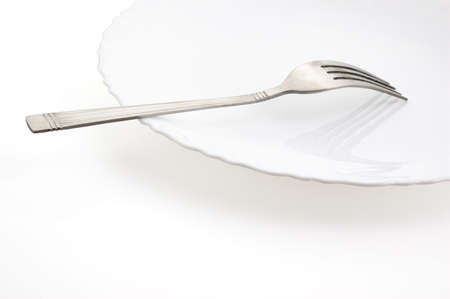 fork and plate on a white background (file contains clipping path)の写真素材