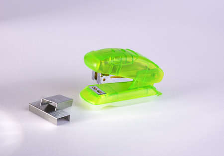 stapler & bracket on a light backgroundの写真素材