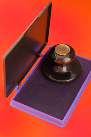 stamps and stamp pillow (on a dark red background)の写真素材